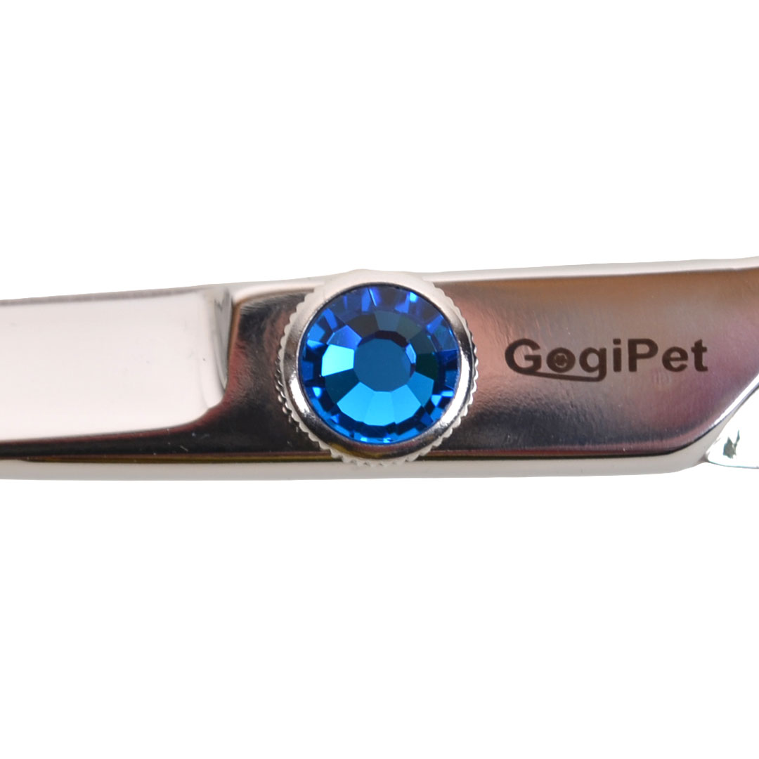 Practical adjusting screw with gemstone for tool-free readjustment of the dog clippers