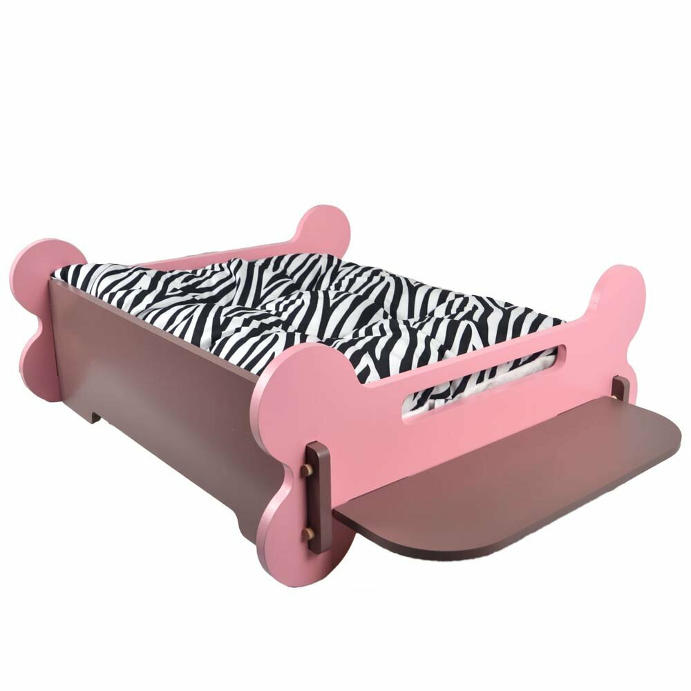 Pet bed with reversible cushion