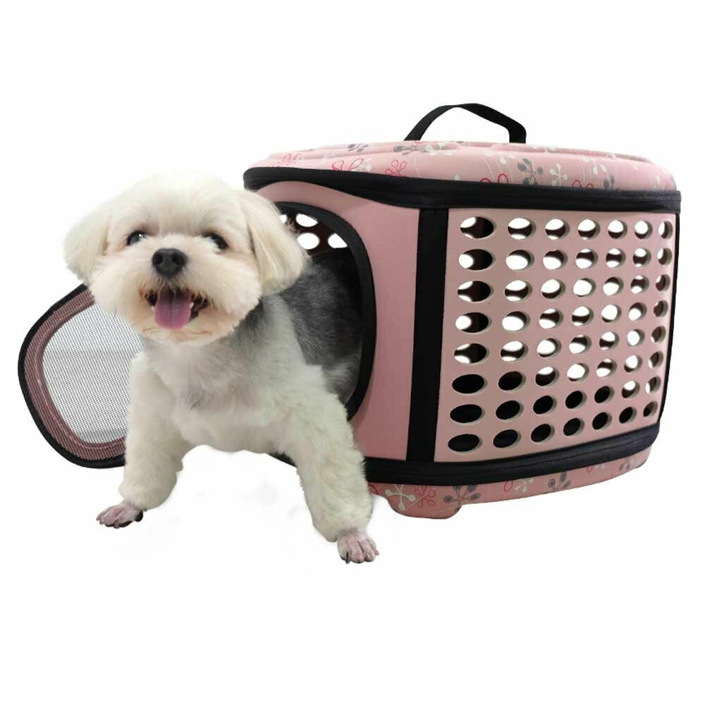 Pink dog carrier with flowers can also be used as a dog bed